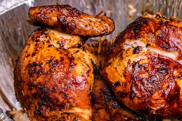 Wood-fired roast chicken with golden crispy skin cooked in a Gozney Dome oven