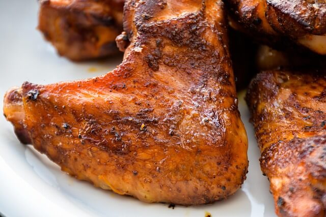 Juicy grilled chicken thighs cooked over live fire with crispy skin and smoky flavor