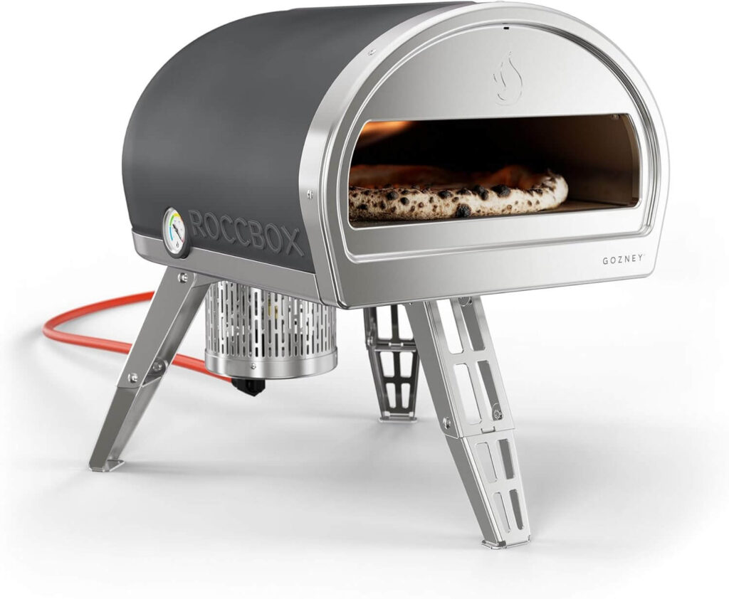 Gozney Roccbox portable pizza oven baking a fresh pizza during a real cooking session