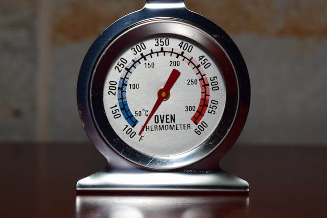 Oven thermometer showing temperature reading