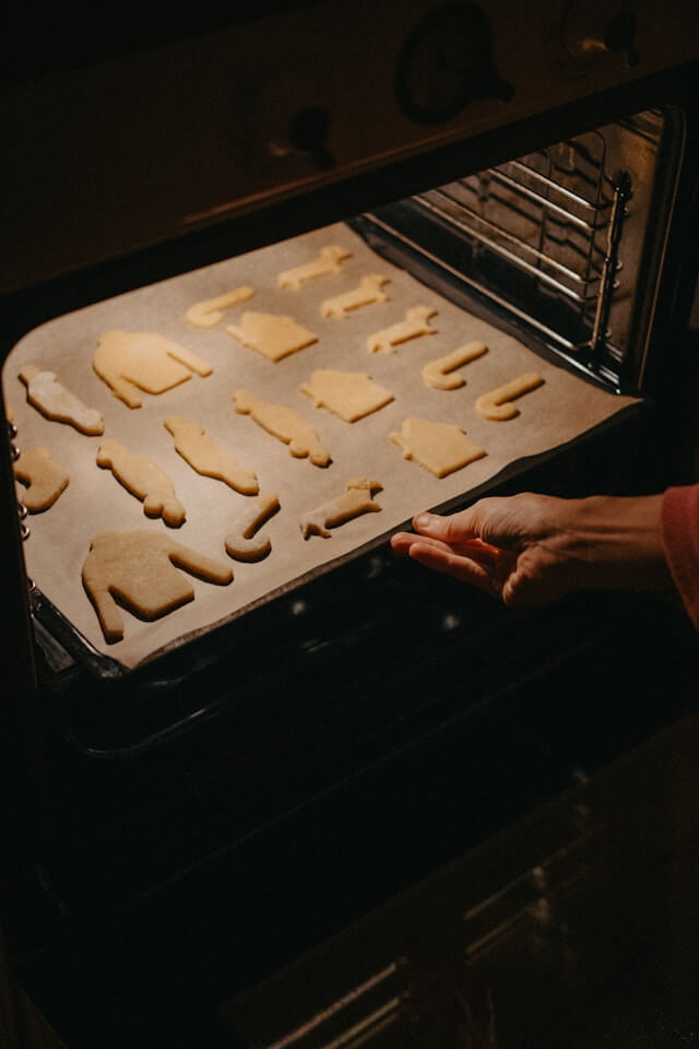 Opening the oven door while cookies are baking